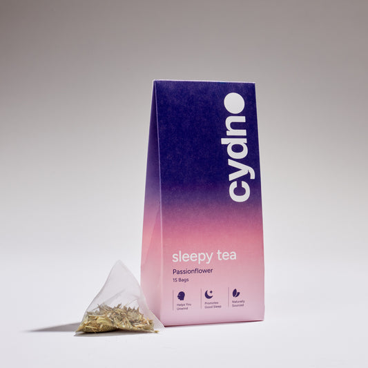 A box of Cydno sleepy tea with passionflower, featuring a single tea pyramid packet in front.
